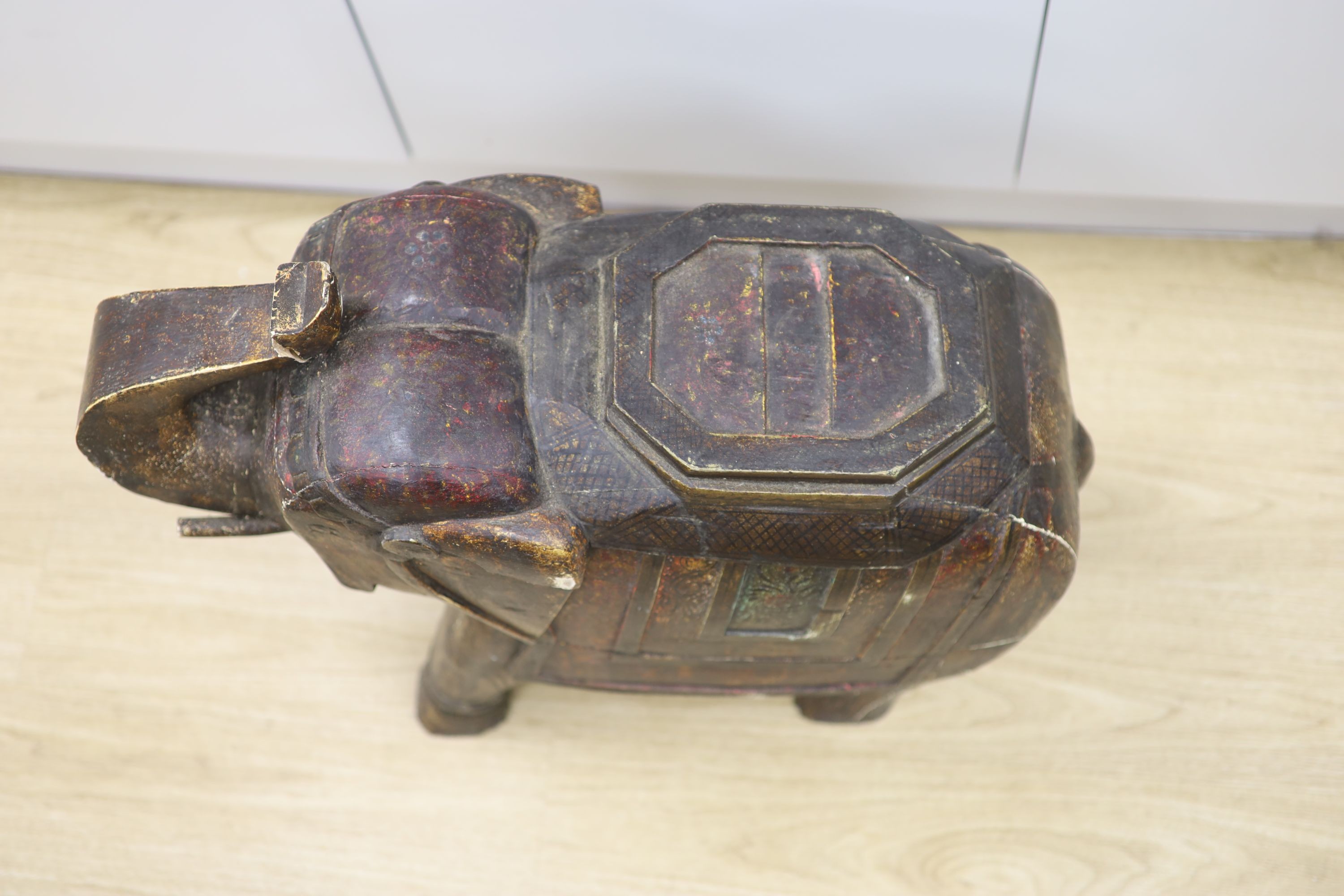 A large Indian painted and carved wood elephant figure, 59 cm high